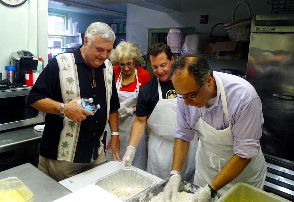 Dr. Augusto Ochoa, Director of the LSU Health Stanley S. Scott Cancer Center, takes a time out to join Al Copeland, Jr as he prepares food for the Annual Fried Chicken Festival, which benefits the Cancer Center’s immunotherapy program. 